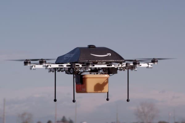drone in flight delivering Amazon Prime products