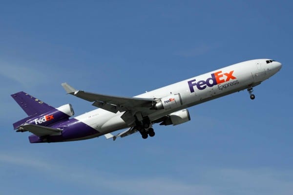 fed ex branded plane in flight