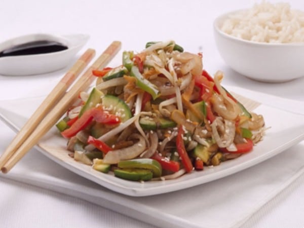 a typical Chop Suey dish, plated, with chopsticks