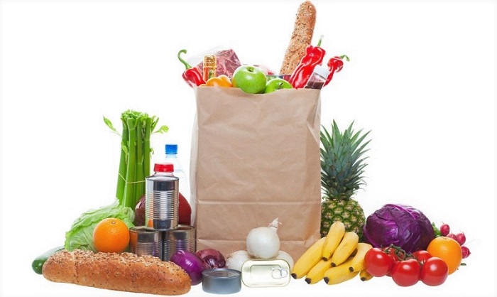 a large paper bag full of groceries