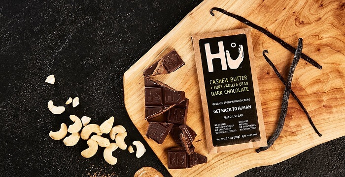 hu ktichen banner with hu cashew butter dark chocolate on a kitchen table