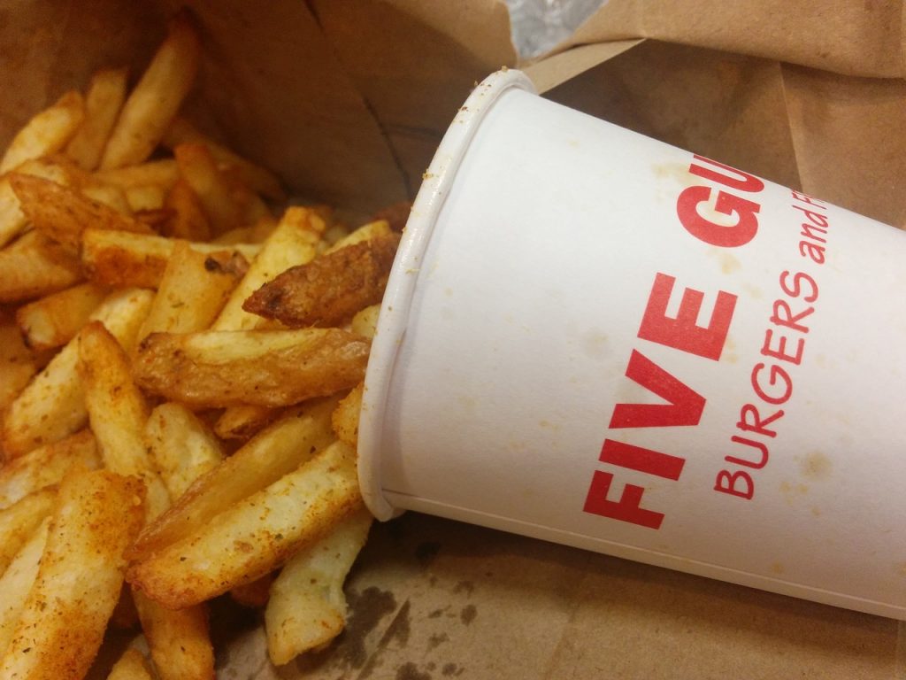 Five guys cup near a fries